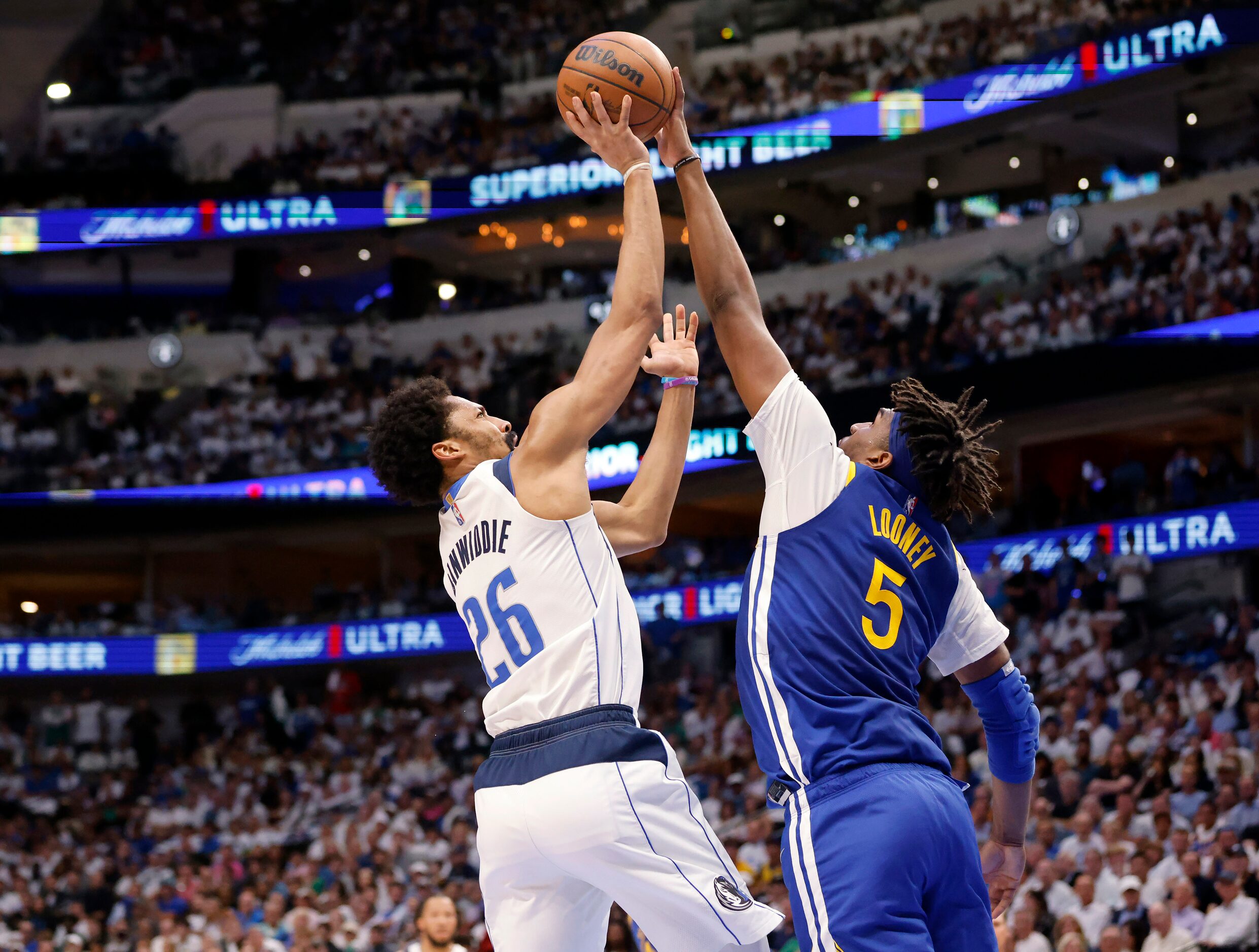 Dallas Mavericks guard Spencer Dinwiddie (26) has his shot blocked by Golden State Warriors...