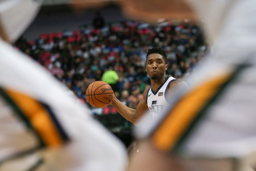 FILE - Jazz guard Donovan Mitchell (45) looks to make a pass during the first half of a game...