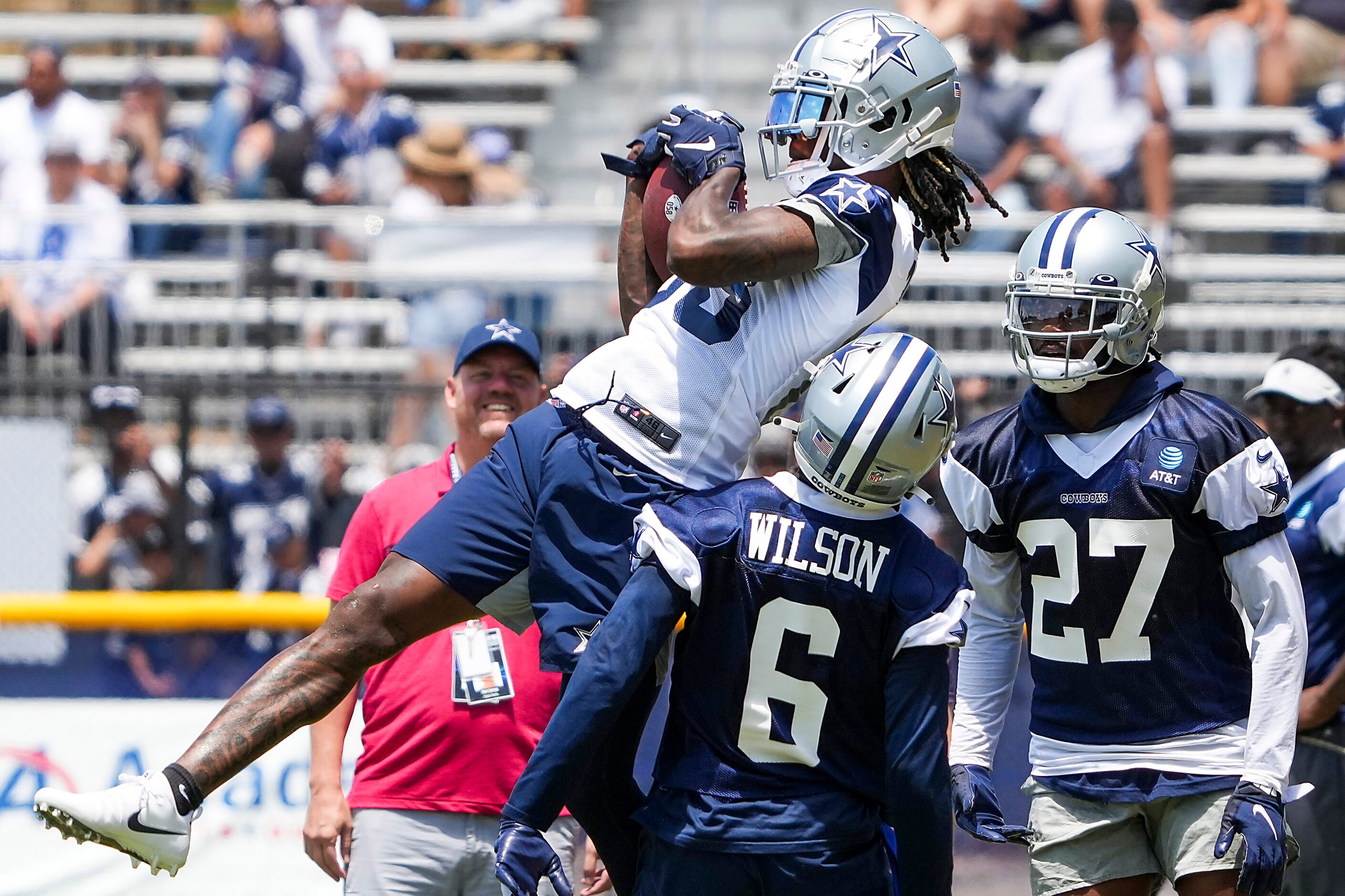 Dallas Cowboys wide receiver CeeDee Lamb (88) makes a catch over safety Donovan Wilson (6)...