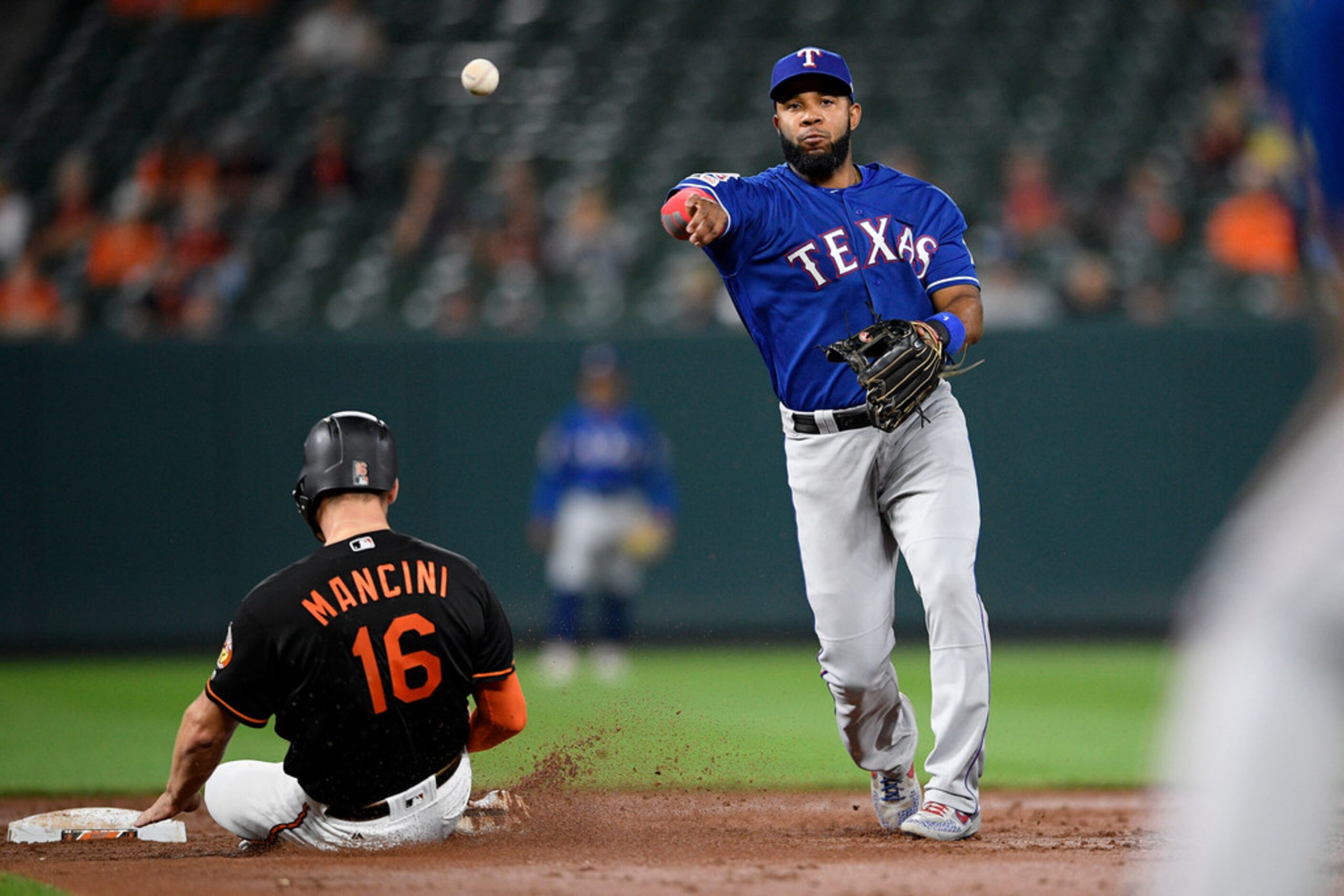 Baltimore Orioles' Trey Mancini (16) is out at second as Texas Rangers shortstop Elvis...