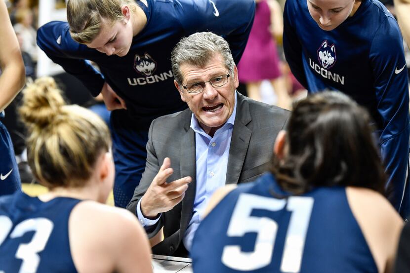 Connecticut coach Geno Auriemma gives instruction to his team during the second half of an...
