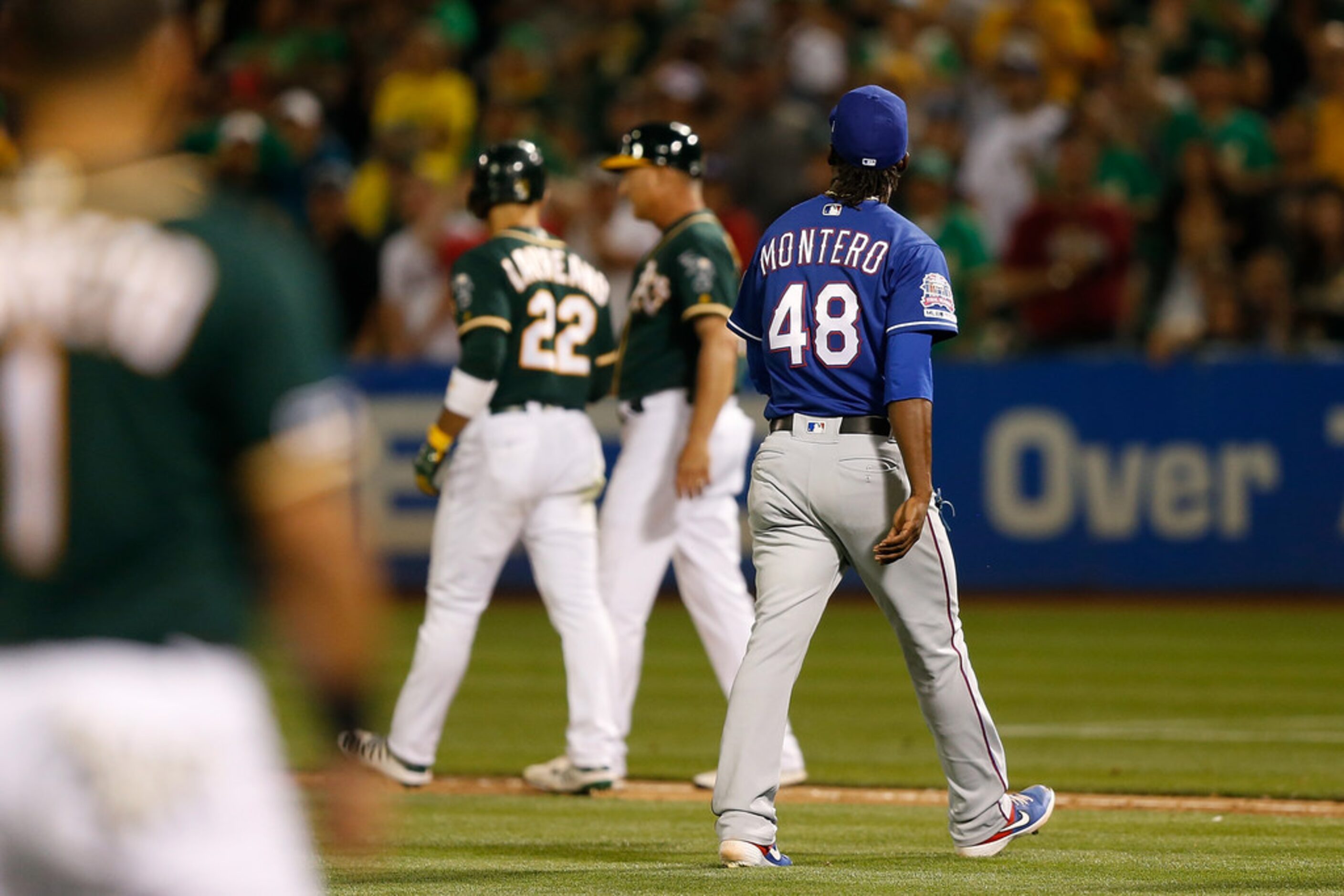 OAKLAND, CALIFORNIA - JULY 27: Pitcher Rafael Montero #48 of the Texas Rangers leaves the...