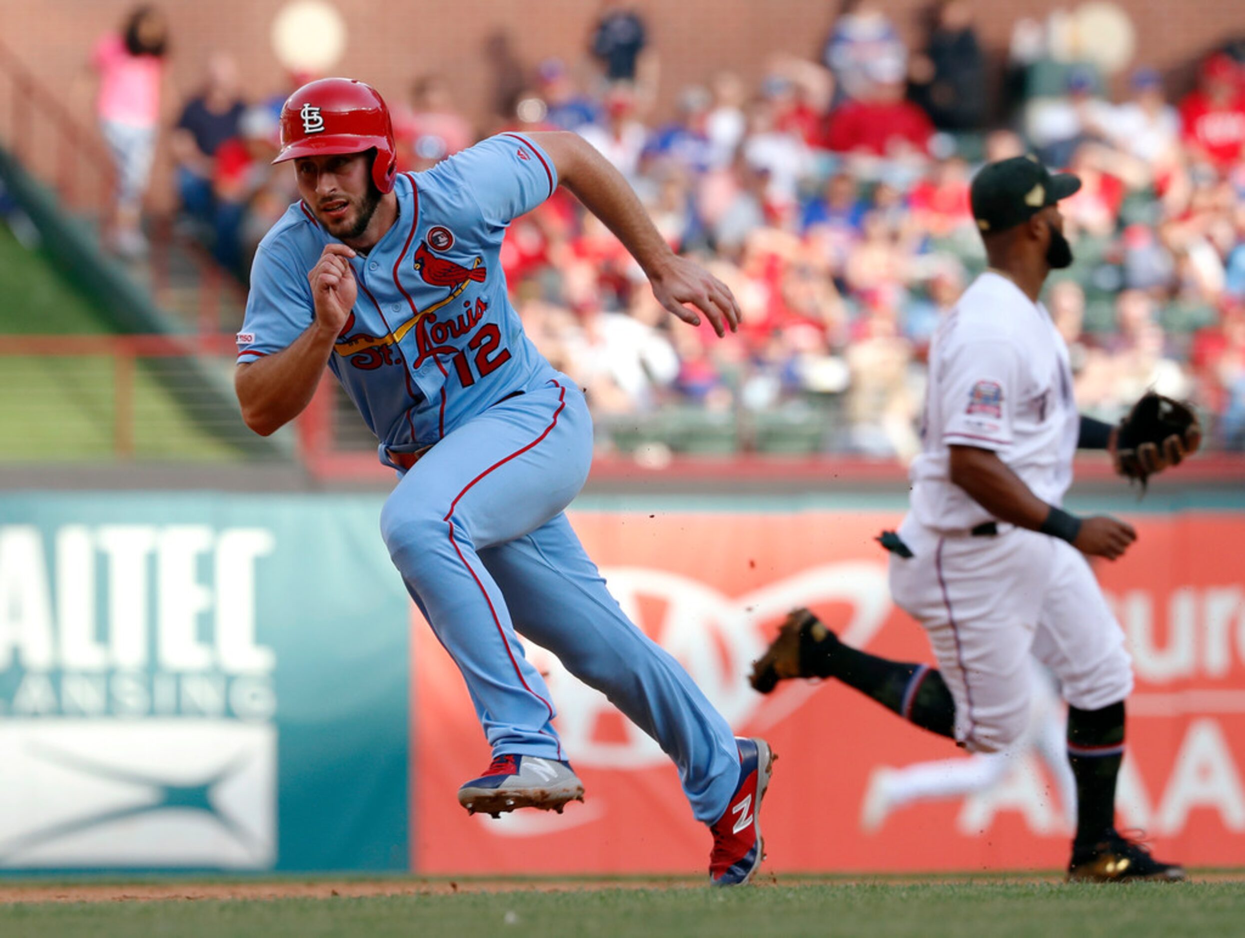 St. Louis Cardinals' Paul DeJong (12) sprints around the bases scoring on a Jose Martinez...