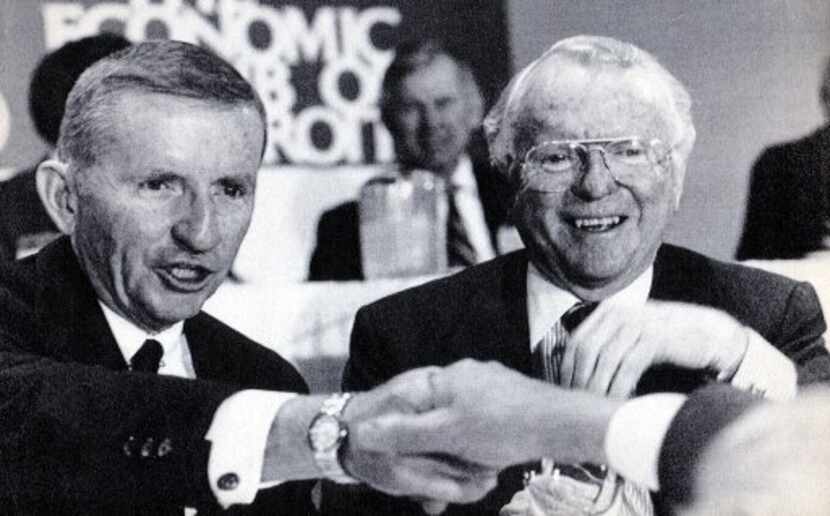  December 9, 1986 - H. Ross Perot (left) and General Motors Chairman Roger B. Smith are seen...