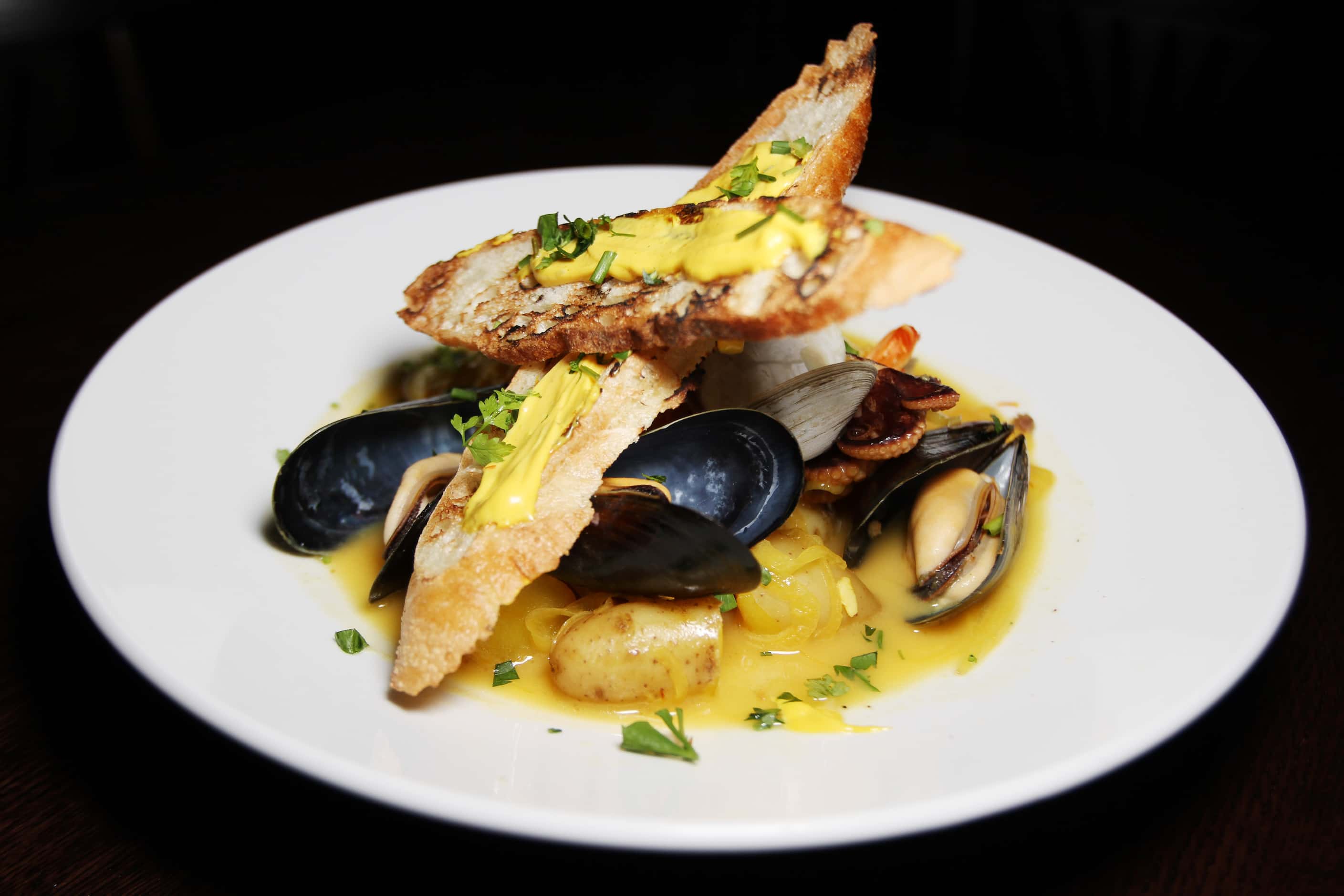 Bouillabaisse Boulevardier, seen here in 2012, is made with lobster-saffron broth.