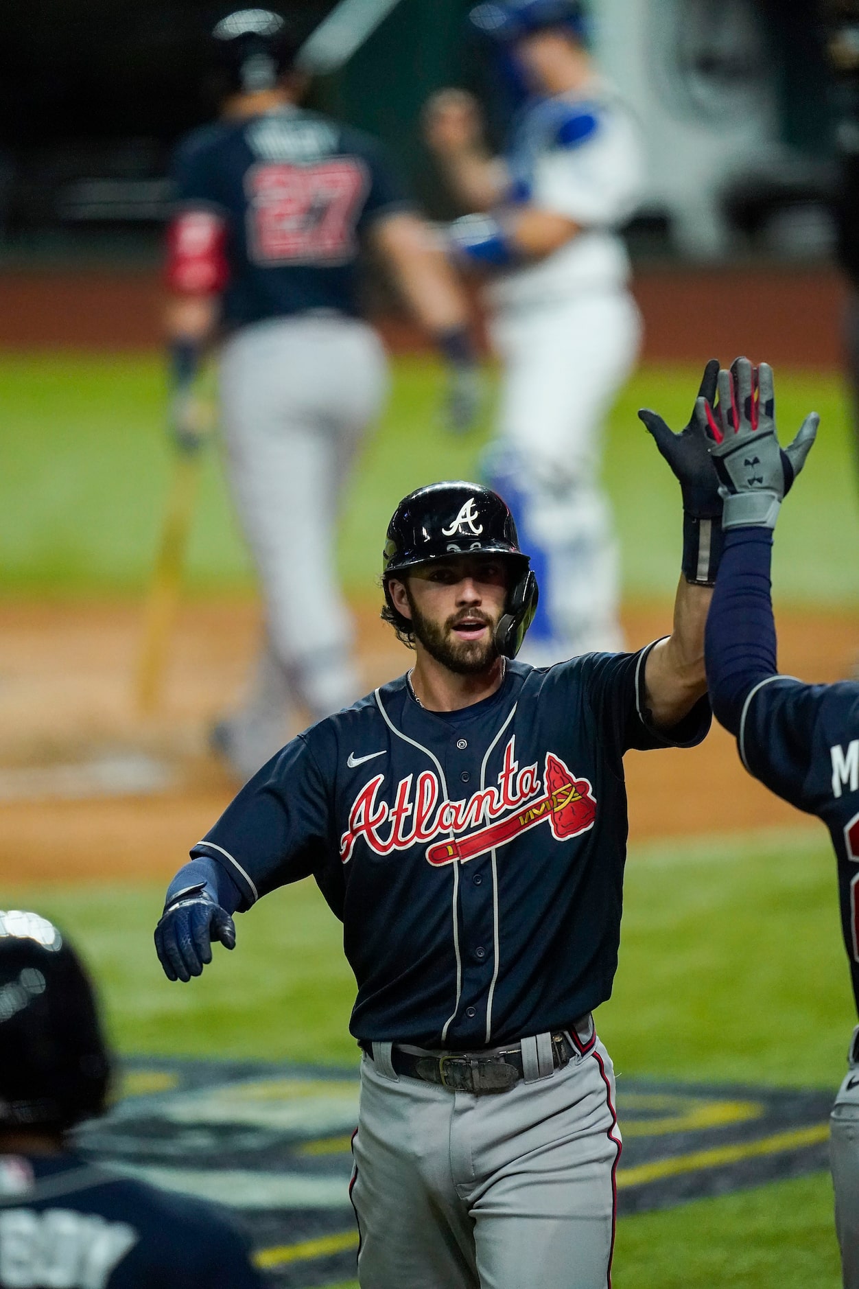 Atlanta Braves shortstop Dansby Swanson celebrates after hitting a solo home run during the...