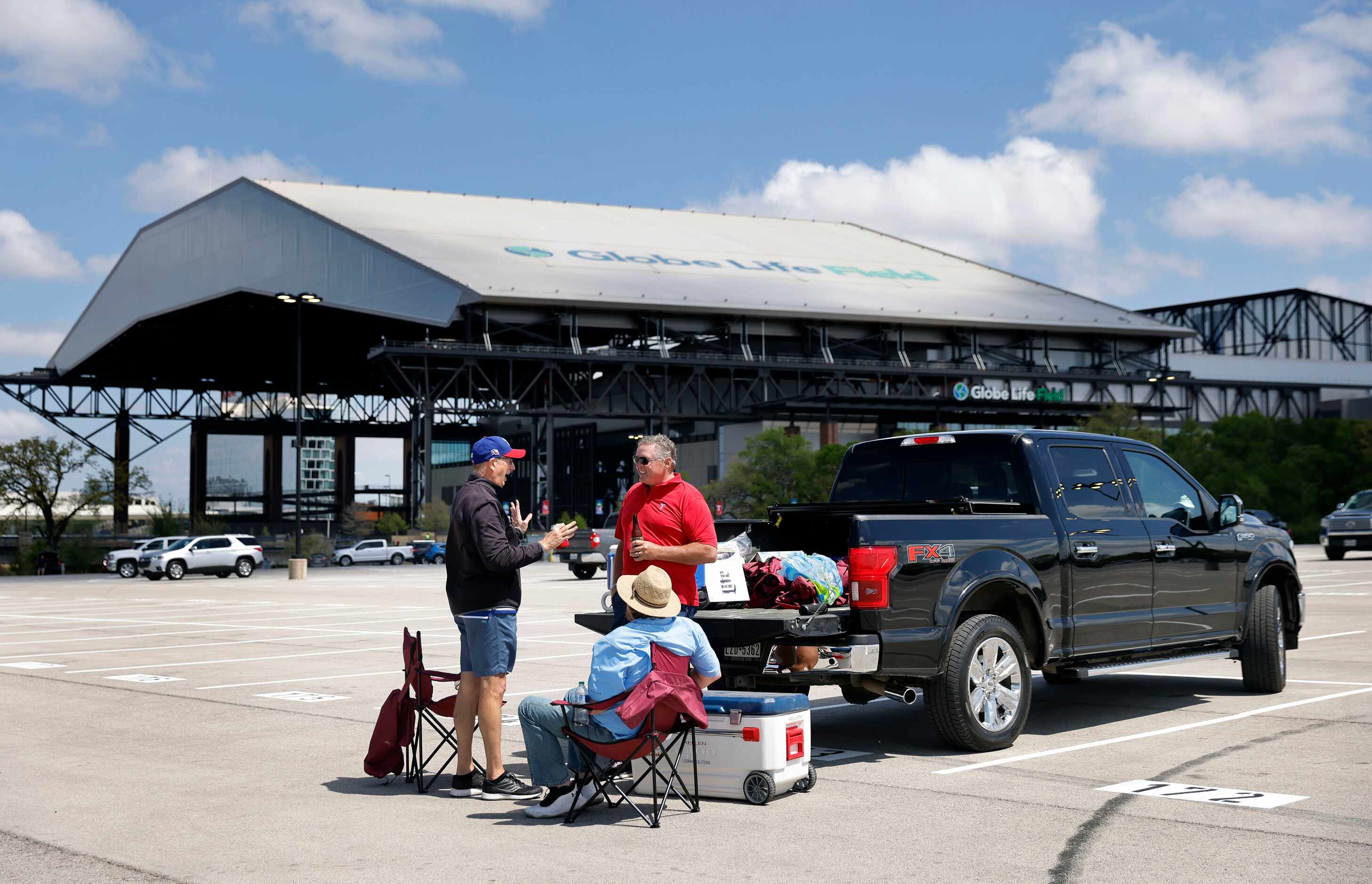 Texas Rangers fans enjoy an Opening Day tailgate party outside of Globe Life Field in...