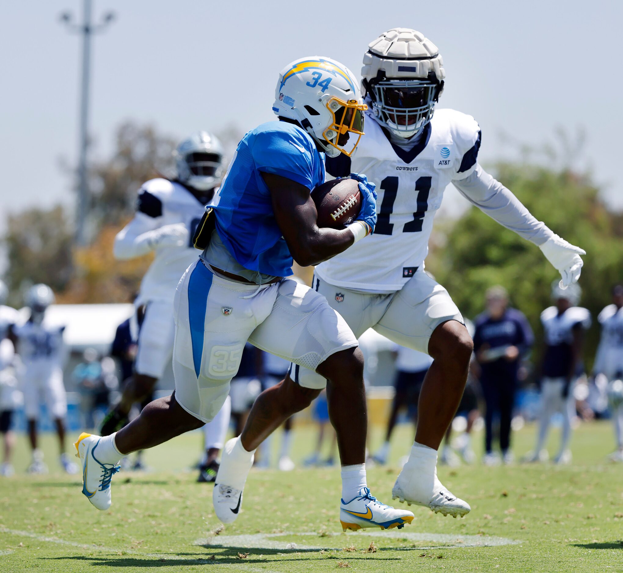 Dallas Cowboys linebacker Micah Parsons (11) chases down Los Angeles Chargers running back...