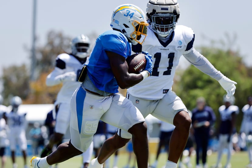 Dallas Cowboys linebacker Micah Parsons (11) chases down Los Angeles Chargers running back...