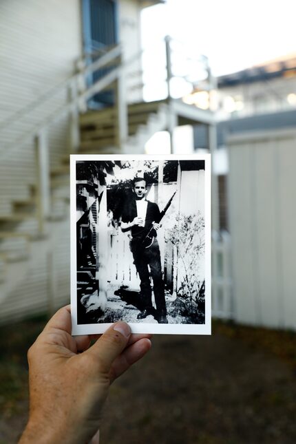 A photo of accused JFK assassin Lee Harvey Oswald holding his rifle is pictured in the same...