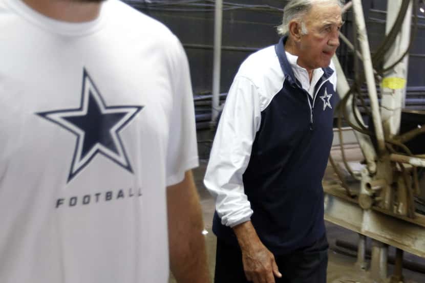 Dallas Cowboys defensive coordinator Monte Kiffin takes the field for warmups before a game...