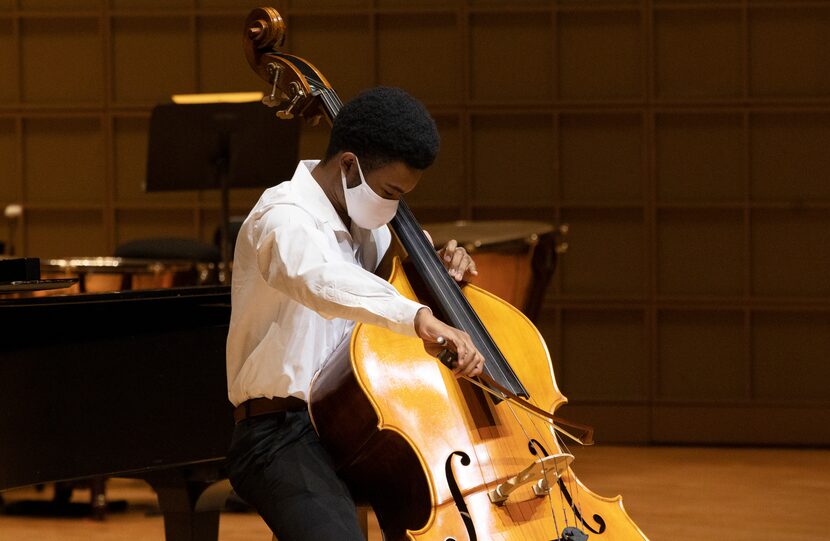 Young Strings student performs at recital.