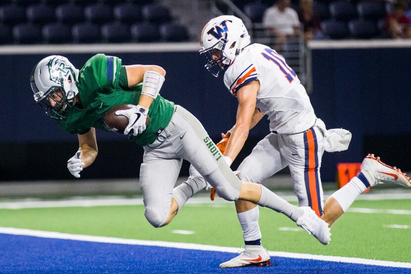 Frisco Reedy wide receiver Ryan Middleton (11) falls in to the end zone for a touchdown...