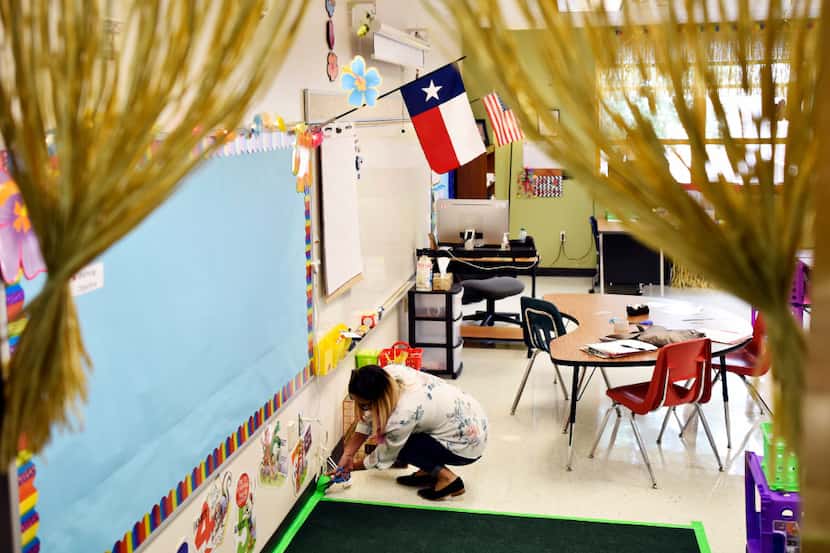 Bilingual teacher Maria Navarro worked last week to prepare her classroom for the first day...