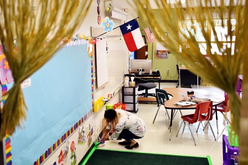 Bilingual teacher Maria Navarro worked last week to prepare her classroom for the first day...