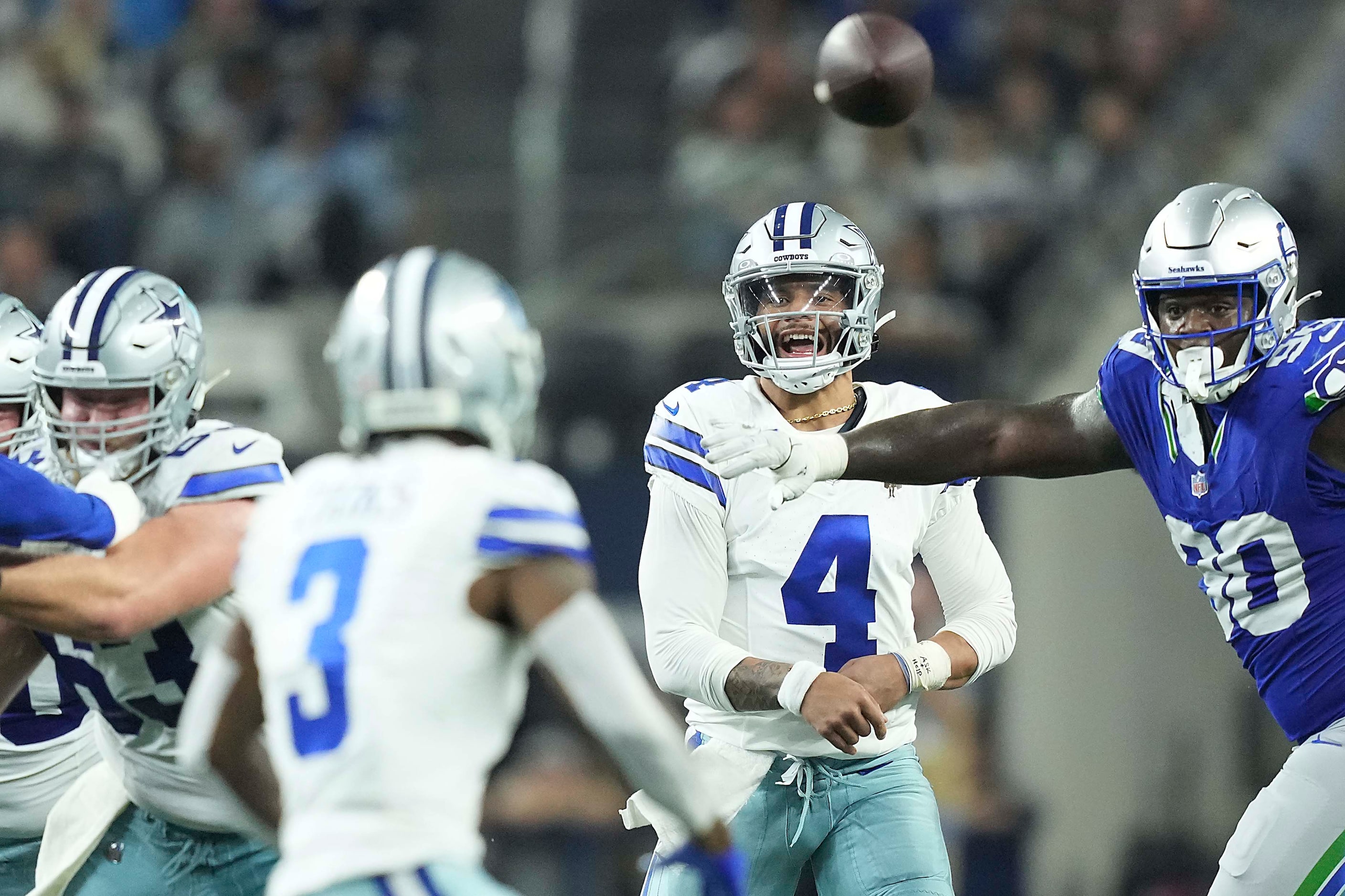 Dallas Cowboys quarterback Dak Prescott (4) completes a pass by wide receiver Brandin Cooks...