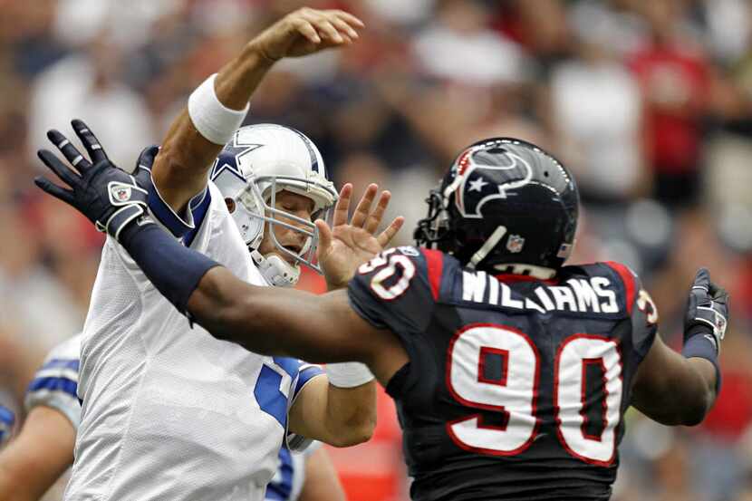 Houston Texans defensive end Mario Williams (90) pressures Dallas Cowboys quarterback Tony...