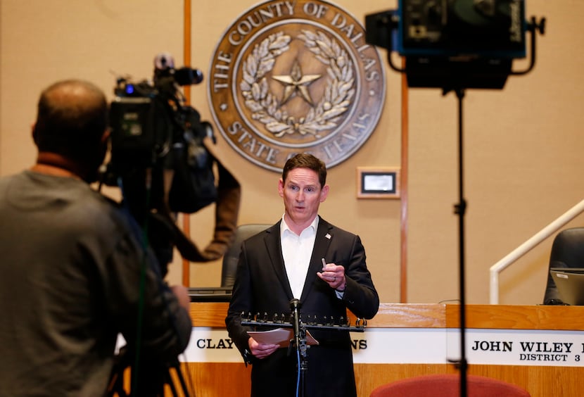 Dallas County Judge Clay Jenkins spoke during a news conference updating an amended order...