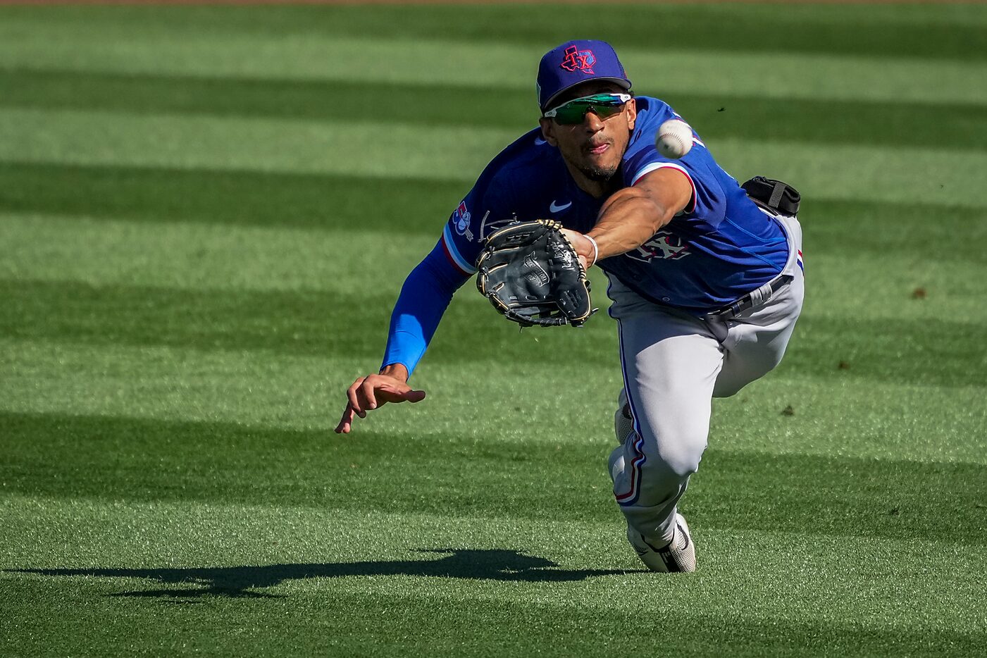 Texas Rangers center fielder Bubba Thompson makes a diving catch on a line drive off the bat...