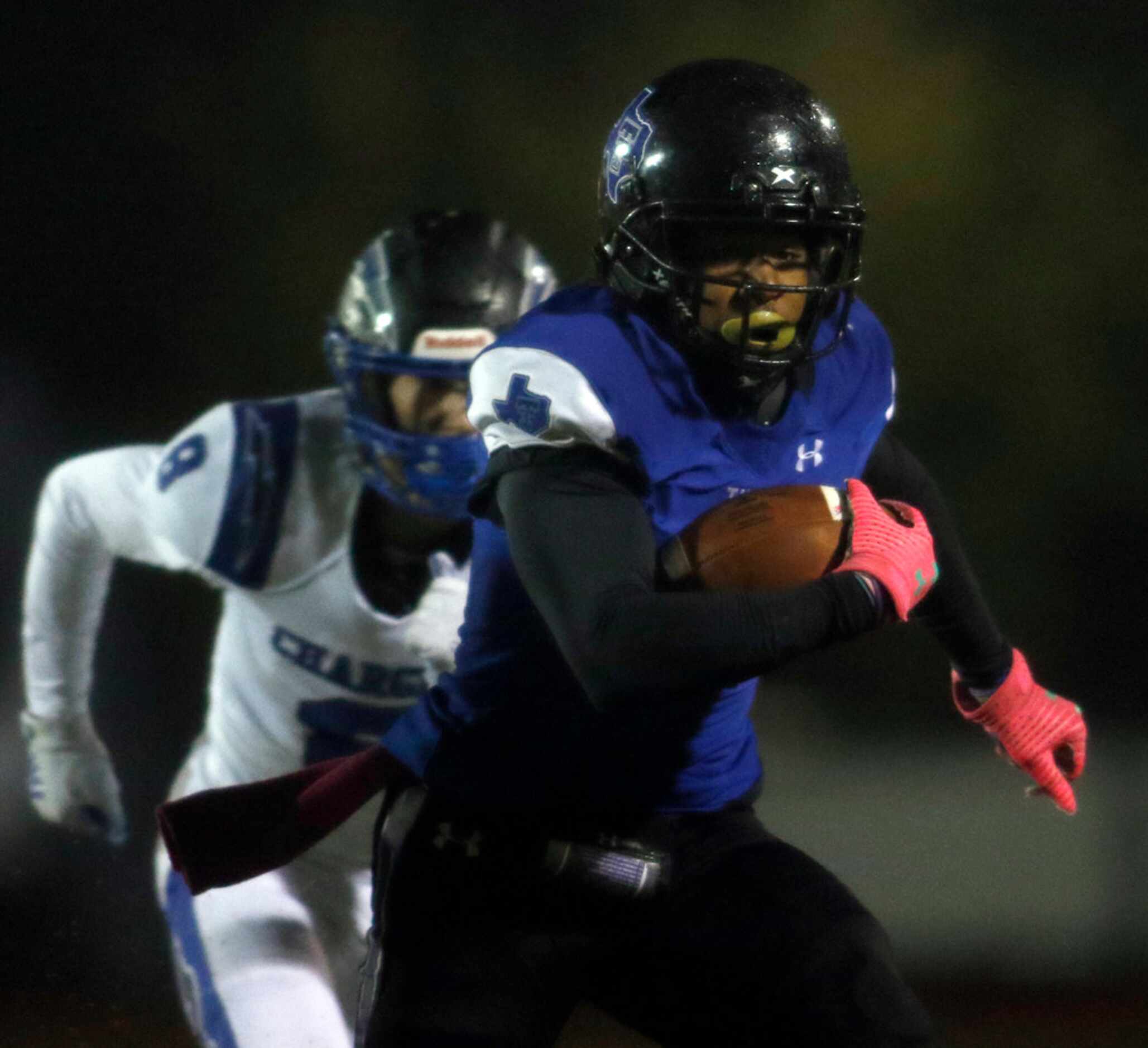 Trinity Christian-Cedar Hill receiver Roderick Weaver (11) tacks yardage on after a first...
