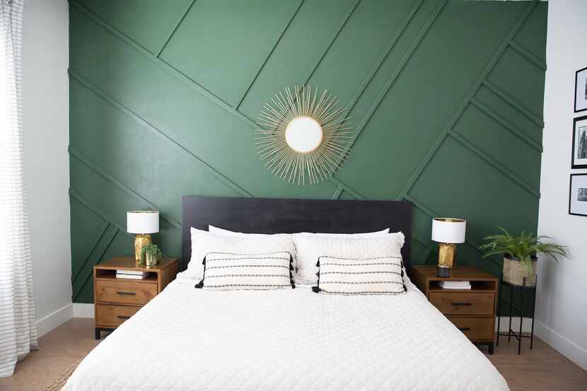 Laura Botelho designed this green accent wall to break up the large, white walls in a...
