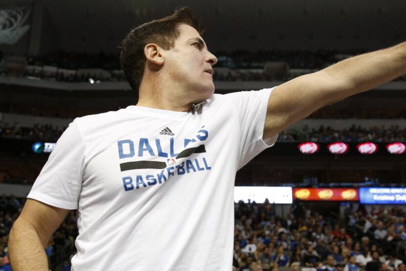 Dallas Mavericks owner Mark Cuban reacts to a call during the second half against the...