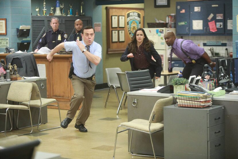 From left: Joe Lo Truglio, Melissa Fumero and Terry Crews make a break for it in the...