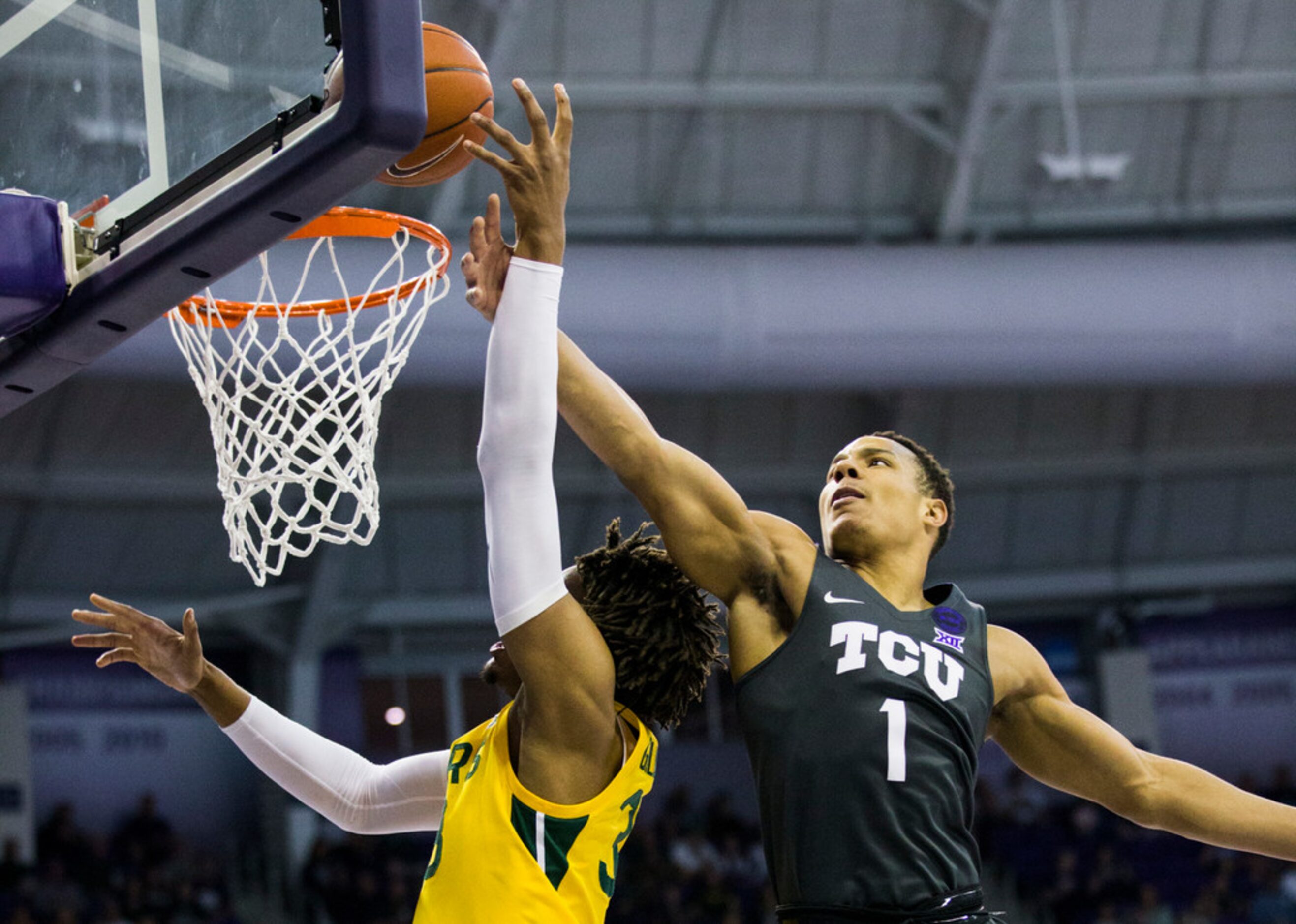 TCU Horned Frogs guard Desmond Bane (1) blocks the shot of Baylor Bears forward Freddie...