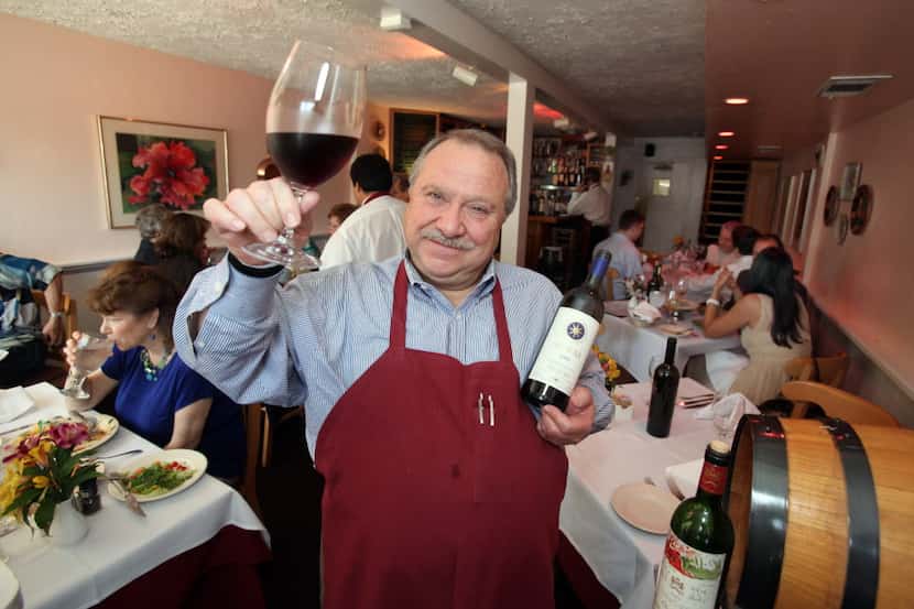 Adelmo Banchetti, owner of Adelmo's Ristorante, makes a toast at the original Cole location. 