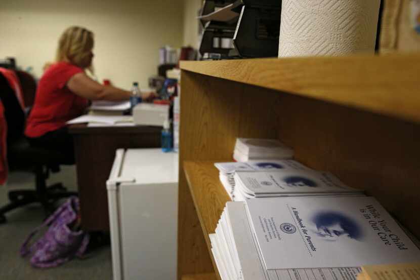 A Tarrant County CPS child-abuse investigator caught up on paperwork last summer. (Nathan...