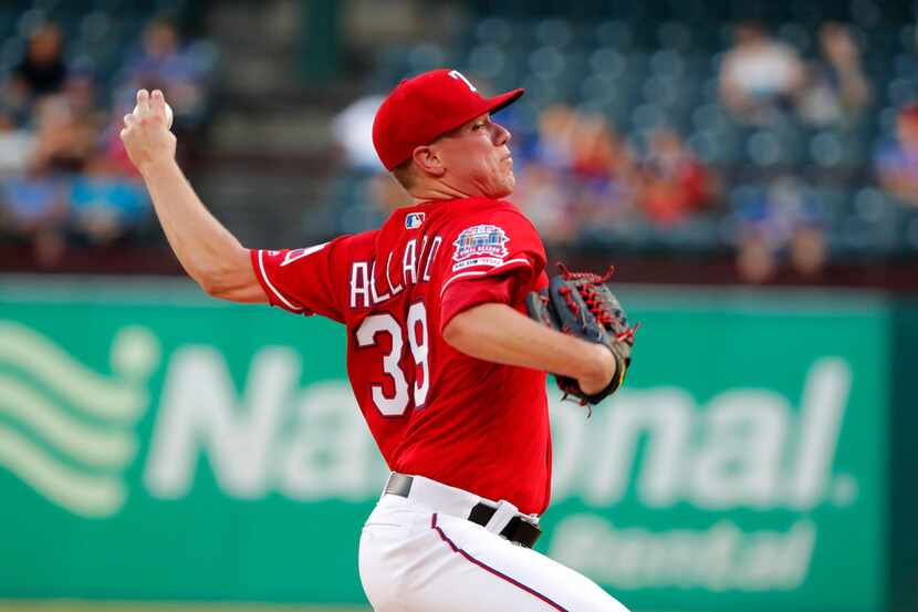 Texas Rangers relief pitcher Kolby Allard throws to the Los Angeles Angels in the first...
