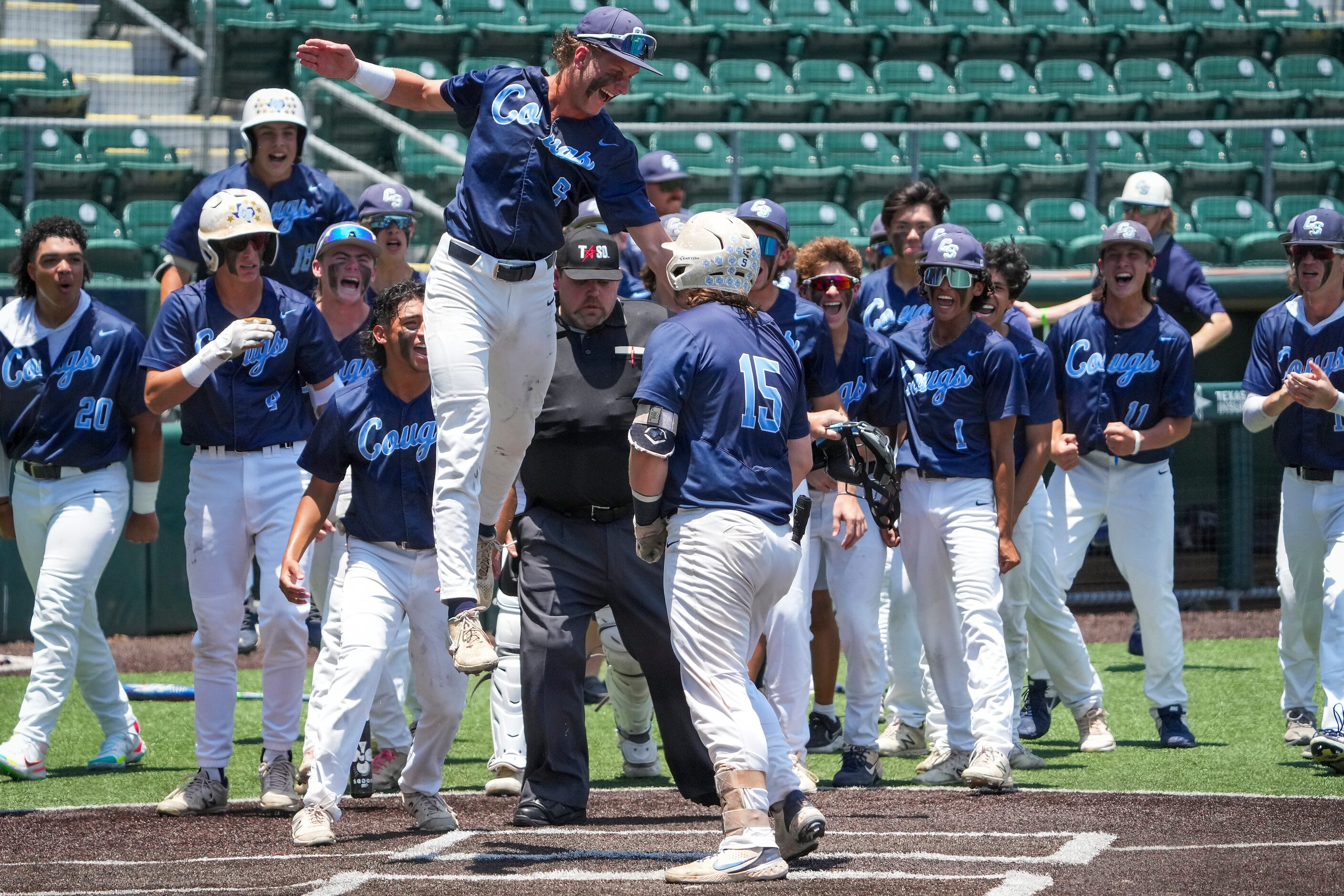 China Spring third baseman Trace Necessary (15) celebrates with teammates after hitting a...