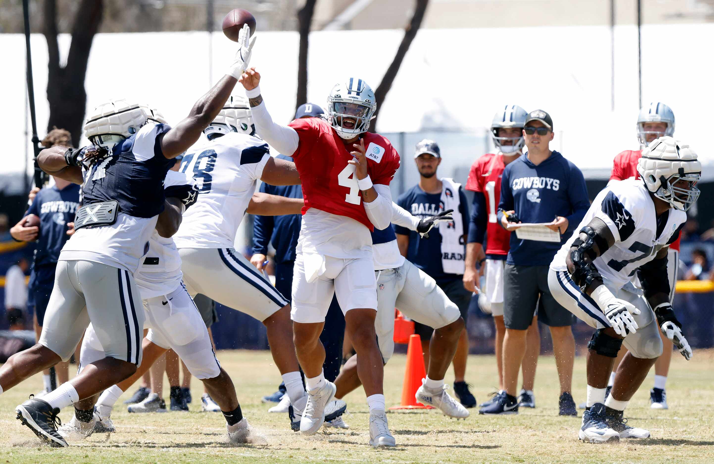 Dallas Cowboys quarterback Dak Prescott (4) throws downfield as the defense collapses around...