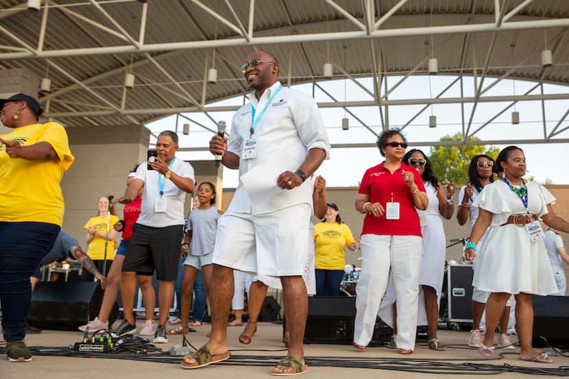 Cedar Hill mayor Stephen Mason (center) dances at the Best Southwest Juneteenth Celebration...