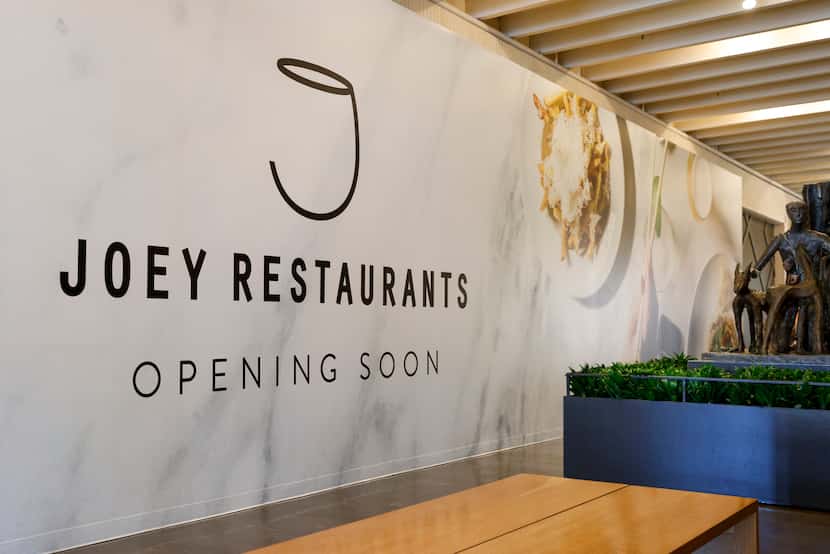 A barricade announces Joey Restaurant is coming to NorthPark Center in space that previously...