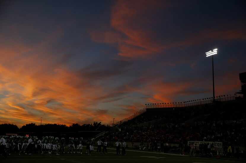 The sun sets prior to a high school football game between Euless Trinity and Southlake...