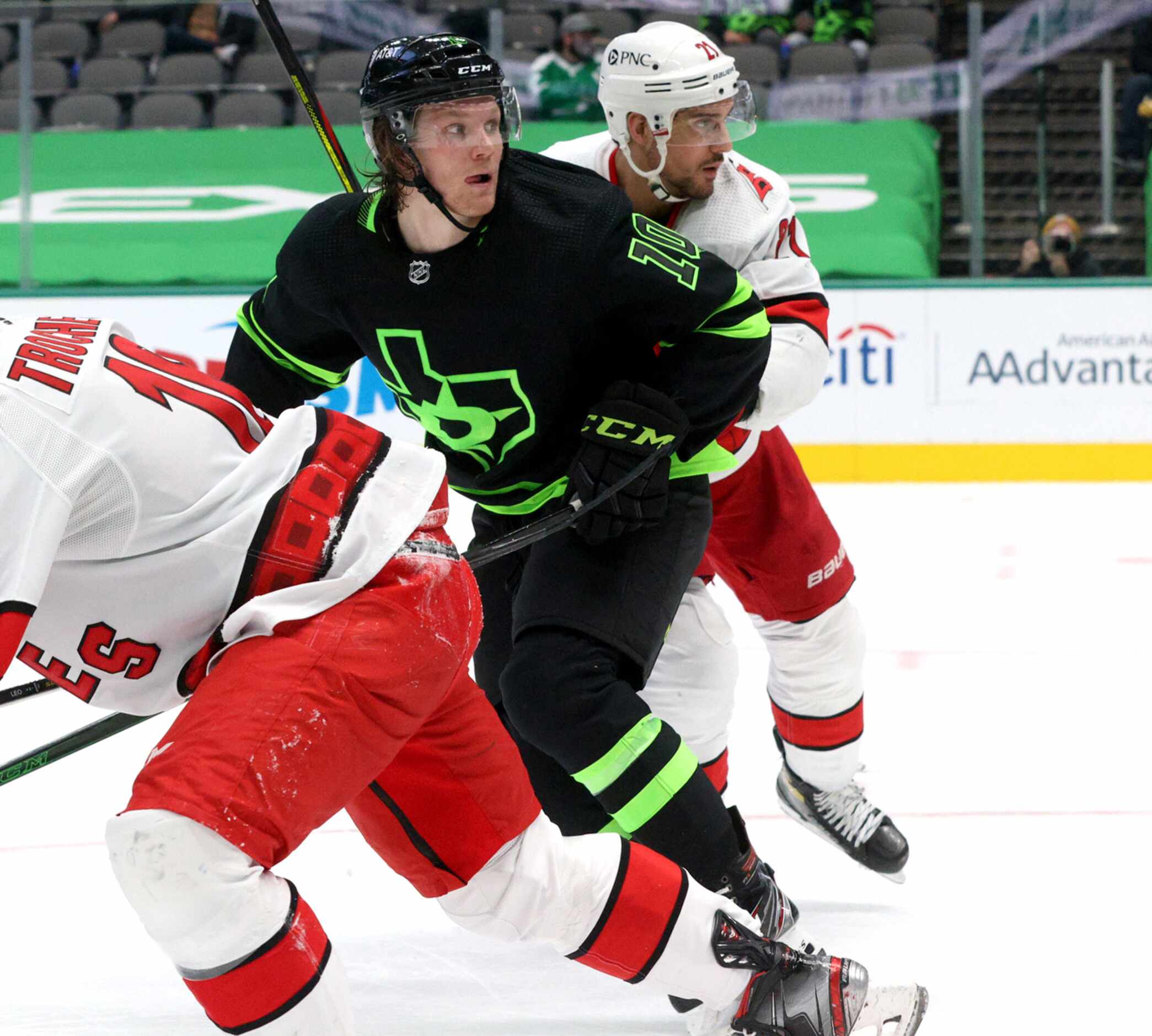 Dallas Stars center Ty Dellandrea (10) and Carolina Hurricanes right wing Nino Niederreiter...