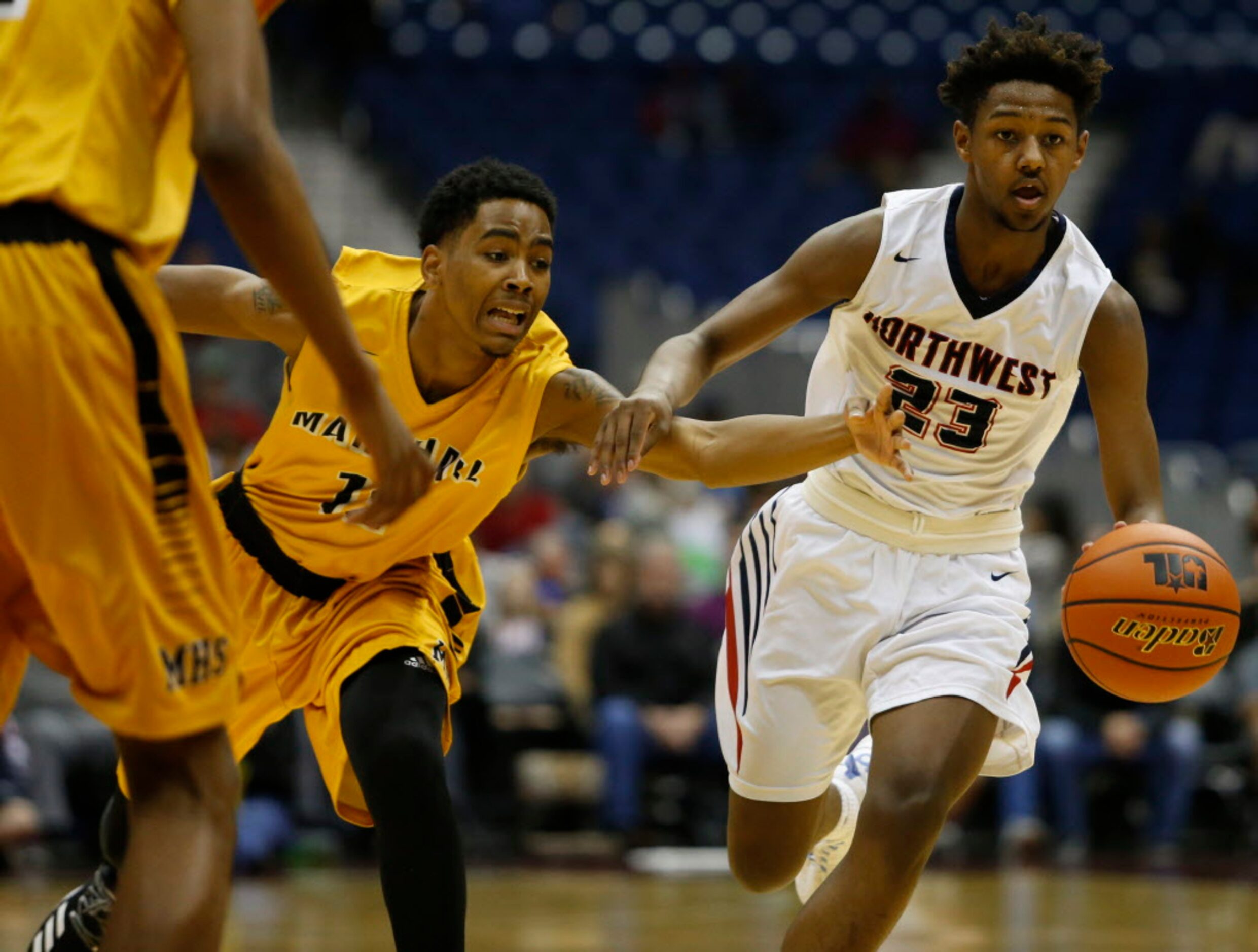 Justin Northwest's Julian Smith (23) looks to get around Fort Bend Marshall's John Walker...