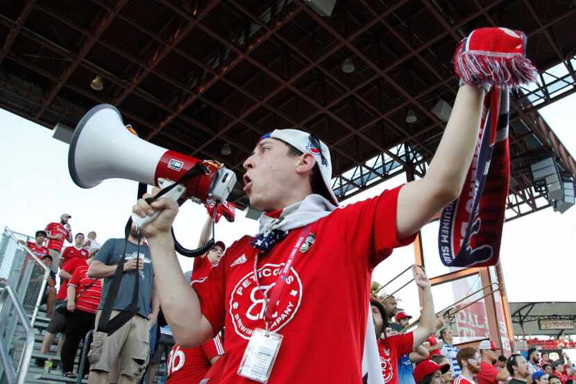 Fans cheer on their team during the first half as FC Dallas hosted Houston Dynamo at Toyota...