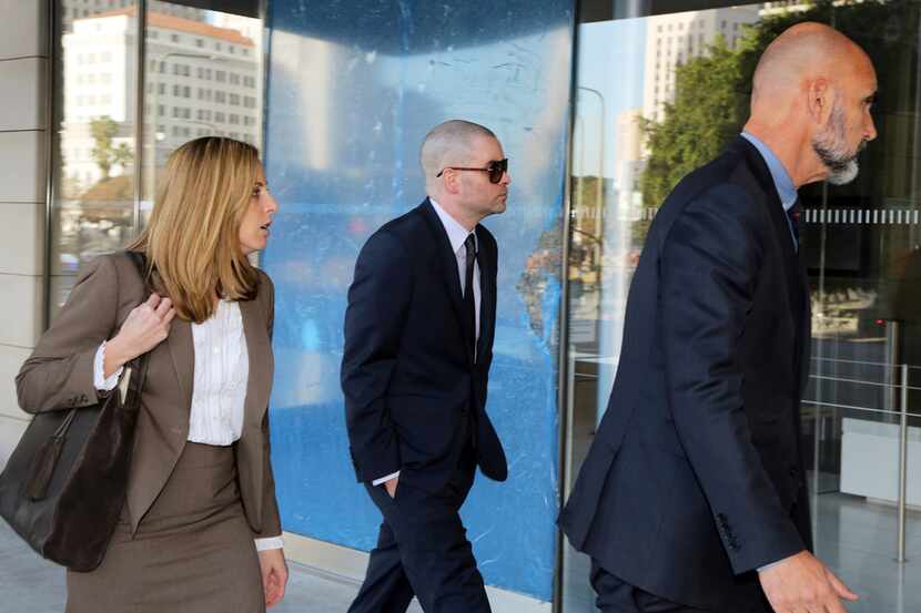 Former "Glee" actor Mark Salling (center) arrived at federal court in Los Angeles on Monday,...