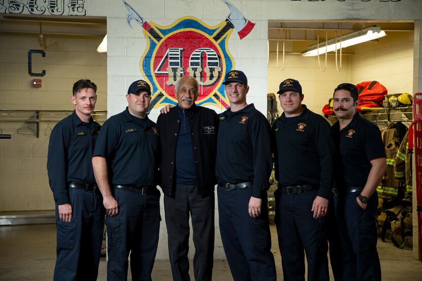Retired Dallas Fire Department Lt. Crest Whitaker Sr. (third from left) with firefighters AJ...