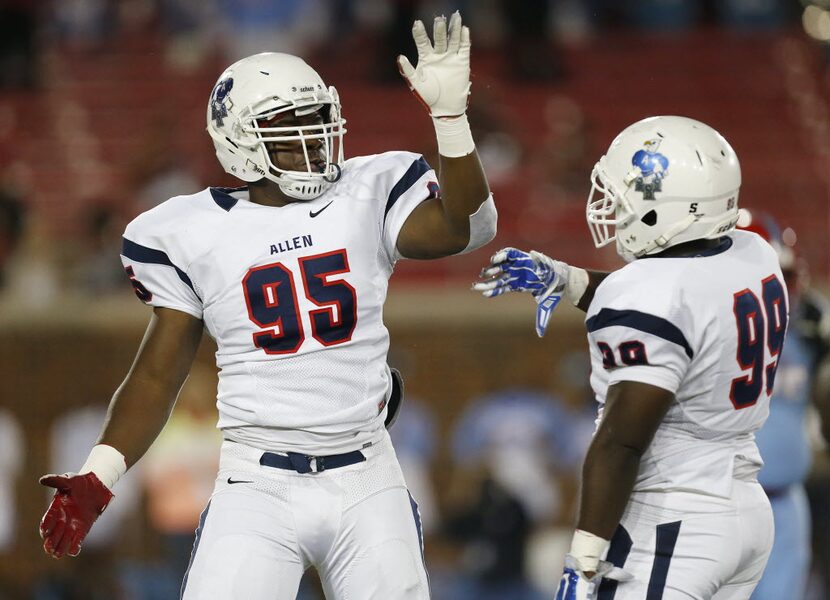 Allen defensive lineman Levi Onwuzurike (95) celebrates with defensive lineman Ryan Hinmon...