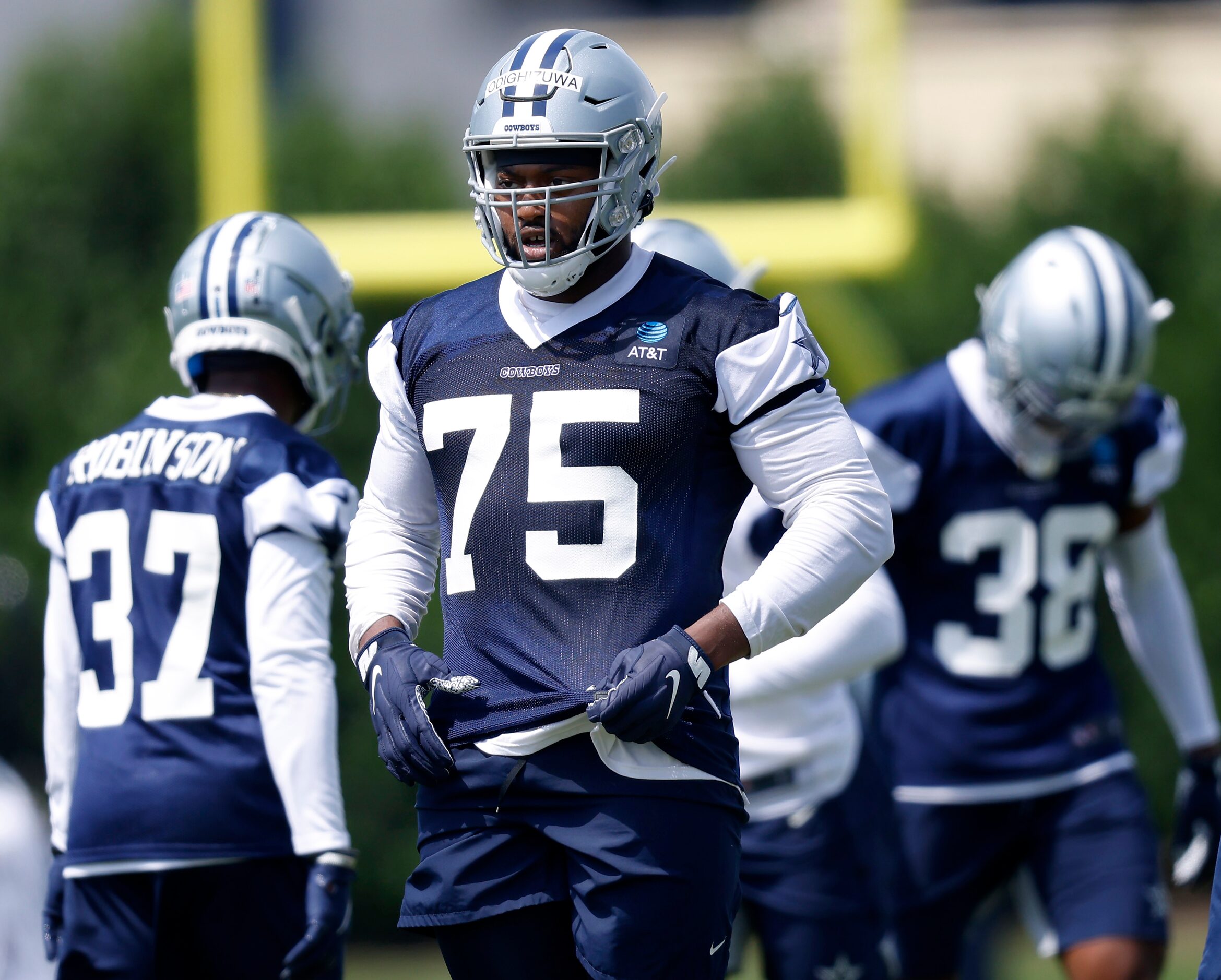 Dallas Cowboys rookie defensive tackle Osa Odighizuwa (75) waits to run another play during...