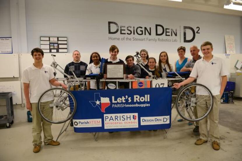 
Parish Episcopal School students and teachers stand around the rover they constructed and...