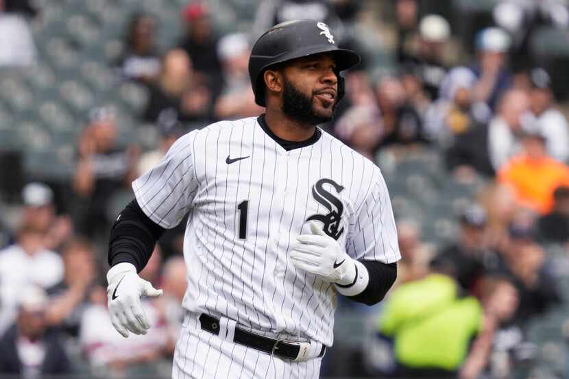Chicago White Sox's Elvis Andrus runs to first base after hitting a single during the fifth...