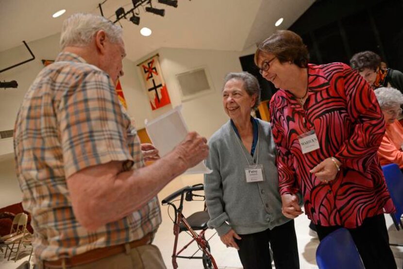 
Is Larkin shows Patsy Affleck (left) and volunteer Marilyn Daily his painting. Casa de Vida...