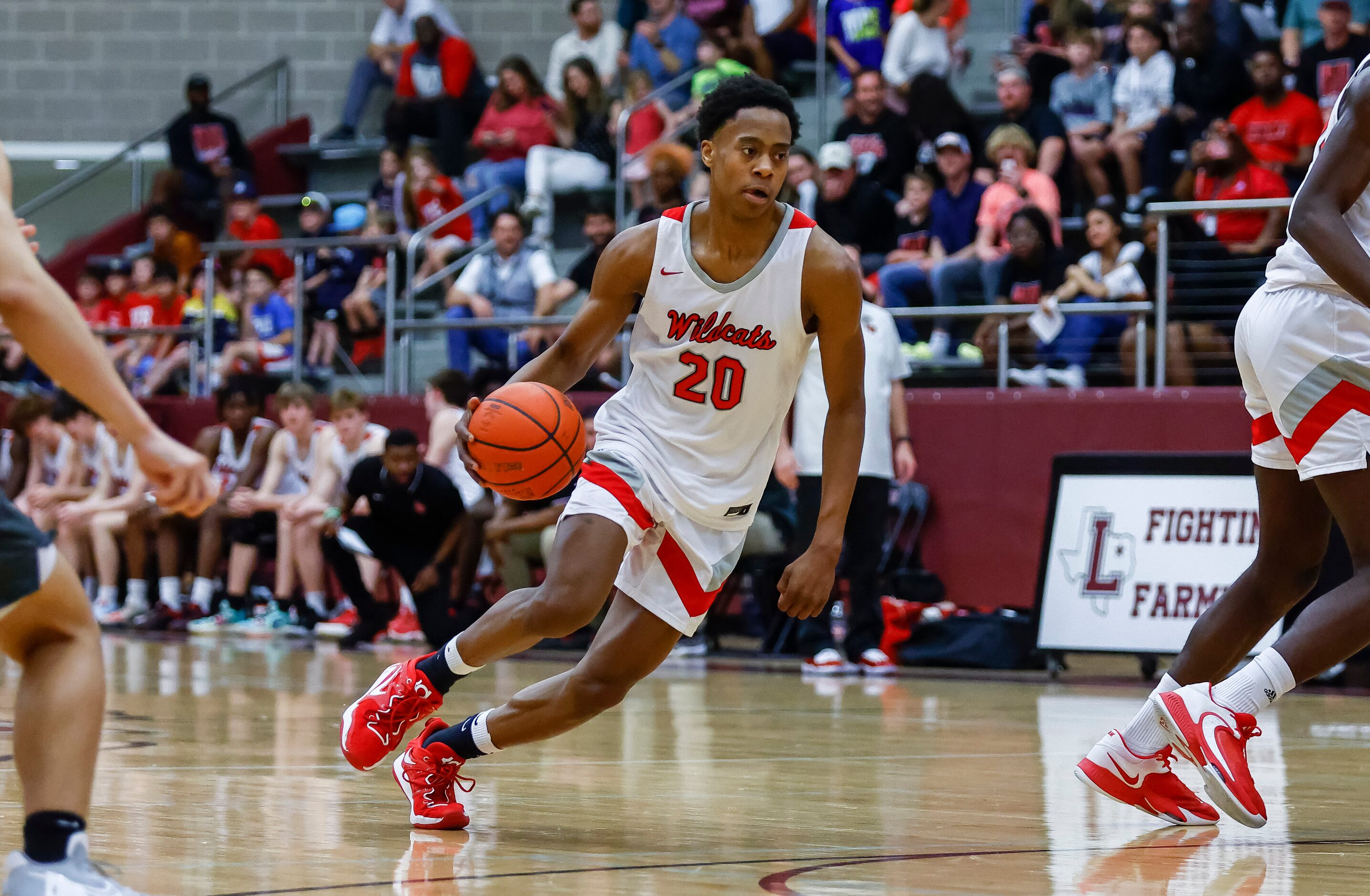 Lake Highlands junior guard Tre Johnson looks for room against the Arlington Bowie defense...