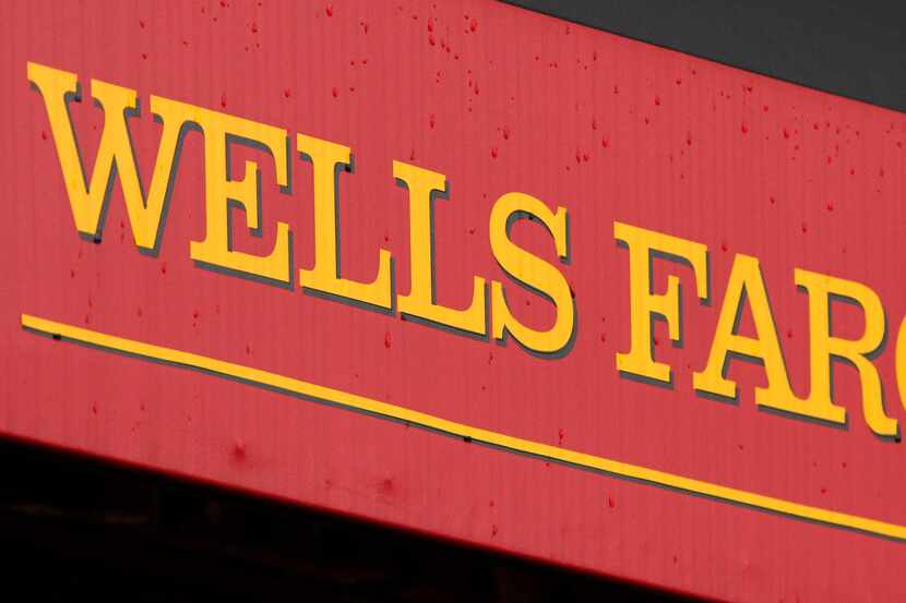FILE - This Jan. 12, 2012 file photo shows the logo at a Wells Fargo Home Mortgage center in...
