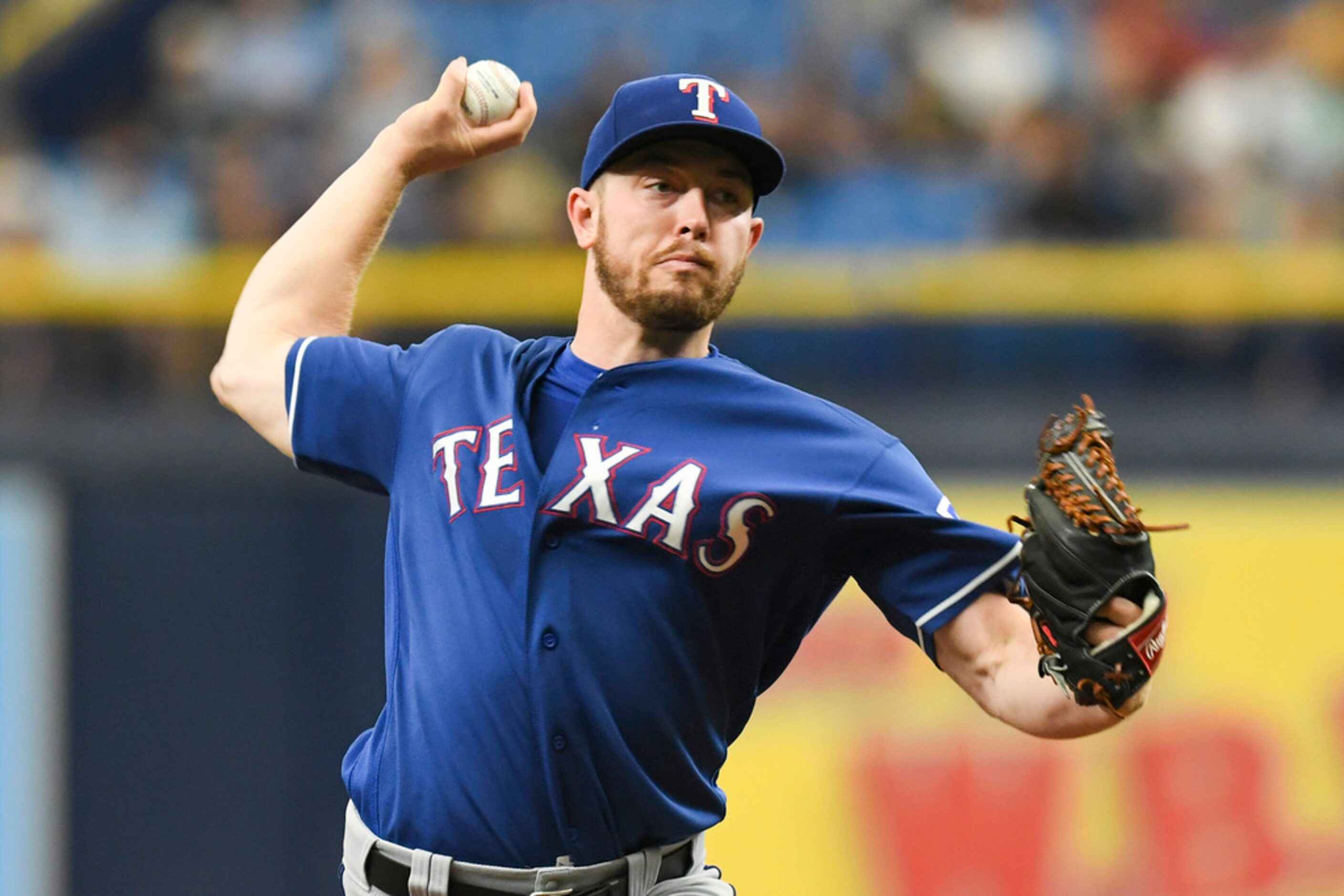 Texas Rangers starting pitcher Adrian Sampson works in the first inning against the Tampa...