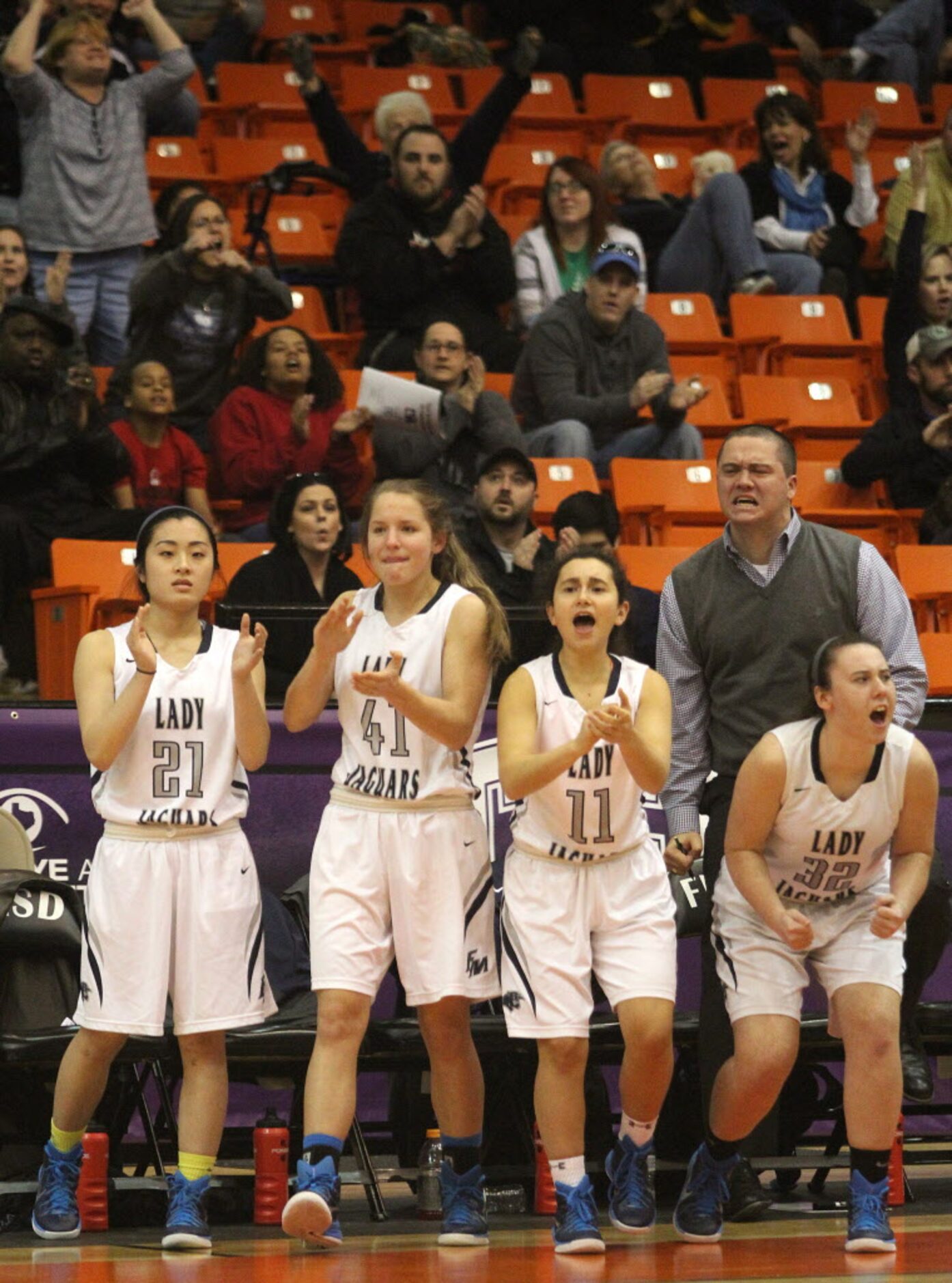 Flower Mound High School senior Pearl Xie (21), junior Stephanie Bridges (41), junior Hannah...